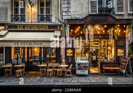 Paris, France, Feb 2020, view of the facades of “Le Gevaudan” a bar-Brasserie and “Chapon” a chocolate store` in the 7th district of the capital Stock Photo